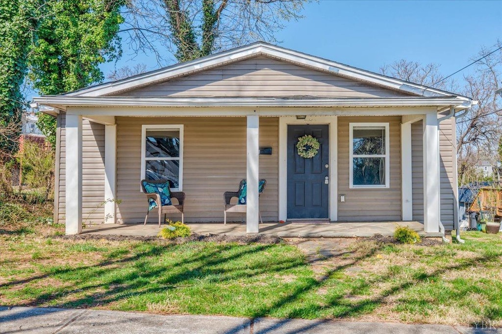 111 Willow St, Lynchburg, VA 24503 - view of front of house with covered porch and a front yard