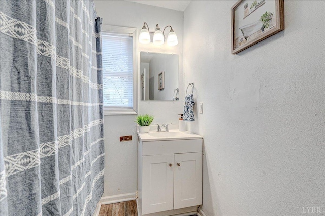 111 Willow St, Lynchburg, VA 24503 - full bath with vanity, curtained shower, baseboards, and wood finished floors