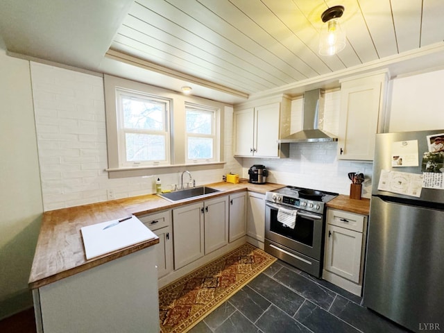 1119 Peaks St, Bedford, VA 24523 - kitchen with appliances with stainless steel finishes, wooden counters, wall chimney exhaust hood, decorative backsplash, and a sink