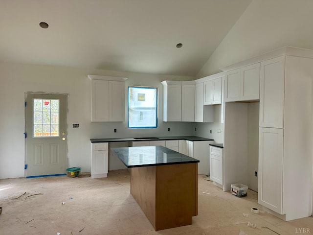 2116 Lime Plant Rd, Appomattox, VA 24522 - kitchen featuring a center island, white cabinetry, vaulted ceiling, and dark countertops