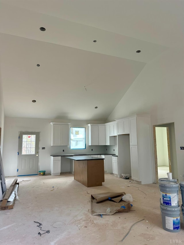 2116 Lime Plant Rd, Appomattox, VA 24522 - kitchen featuring a kitchen island, healthy amount of natural light, high vaulted ceiling, and white cabinets
