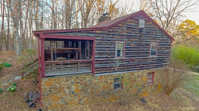 3510 Bear Creek Rd, Rustburg, VA 24588 - view of side of home with stone siding and a chimney