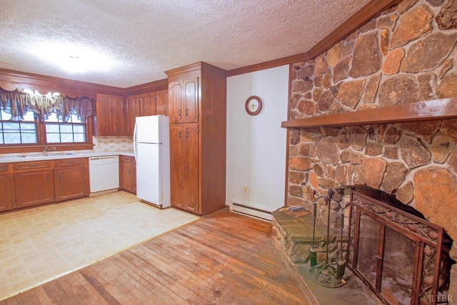 3510 Bear Creek Rd, Rustburg, VA 24588 - kitchen featuring white appliances, a baseboard heating unit, light countertops, light wood-type flooring, and a textured ceiling