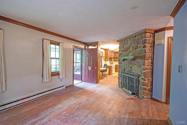 3510 Bear Creek Rd, Rustburg, VA 24588 - unfurnished living room featuring a baseboard heating unit, hardwood / wood-style flooring, a textured ceiling, ornamental molding, and a fireplace