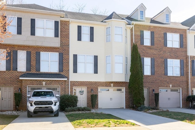 3008 Hill St Unit 306, Lynchburg, VA 24501 - multi unit property featuring a garage, driveway, and brick siding