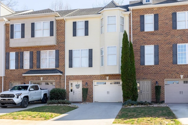 3008 Hill St Unit 306, Lynchburg, VA 24501 - view of property with a garage, driveway, and brick siding