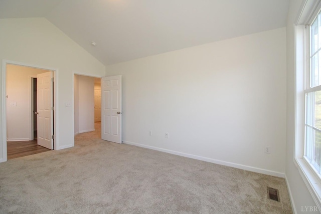 268 Oak Spring Ln, Madison Heights, VA 24572 - unfurnished bedroom with carpet flooring, vaulted ceiling, multiple windows, and baseboards