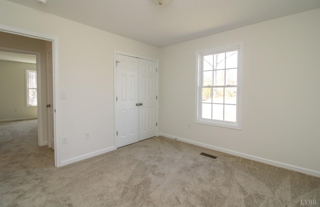 268 Oak Spring Ln, Madison Heights, VA 24572 - unfurnished bedroom featuring carpet, baseboards, and a closet