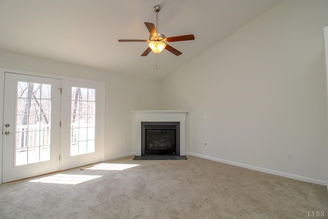268 Oak Spring Ln, Madison Heights, VA 24572 - unfurnished living room featuring carpet, lofted ceiling, ceiling fan, a fireplace with flush hearth, and baseboards