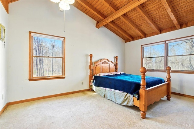 bedroom featuring carpet, multiple windows, and baseboards