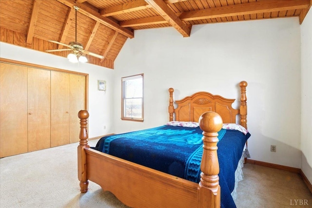 bedroom featuring vaulted ceiling with beams, wooden ceiling, carpet floors, and baseboards