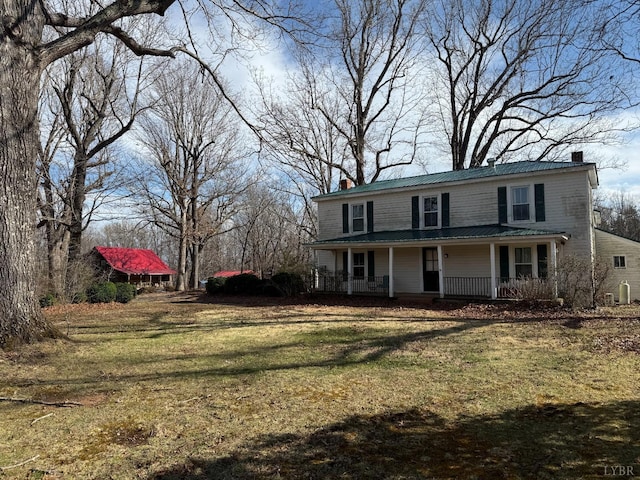1228 Rosser Mill Rd, Pamplin, VA 23958 - view of front of home with a chimney, covered porch, a front lawn, and a metal roof