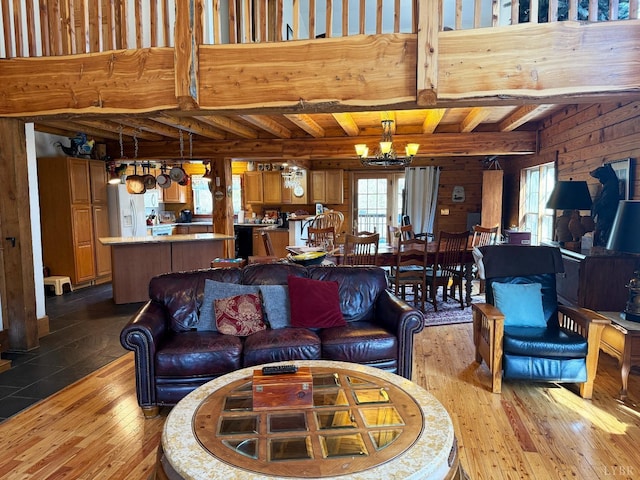 1228 Rosser Mill Rd, Pamplin, VA 23958 - living room featuring a chandelier, hardwood / wood-style flooring, plenty of natural light, beam ceiling, and wood walls