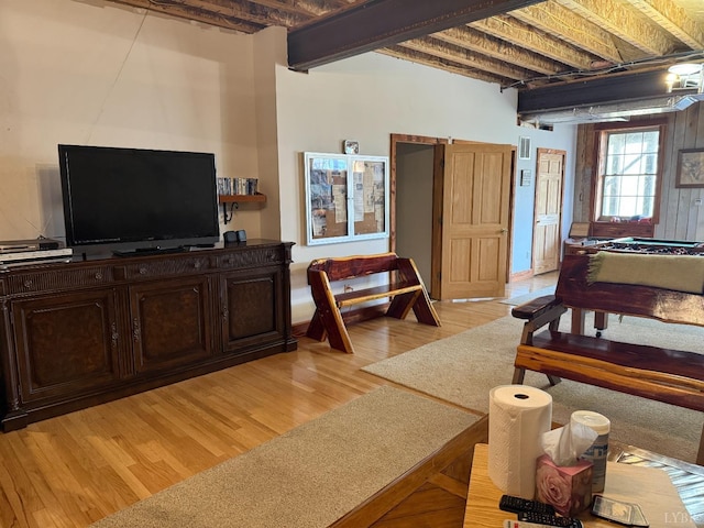 1228 Rosser Mill Rd, Pamplin, VA 23958 - bedroom with light wood-type flooring and beamed ceiling