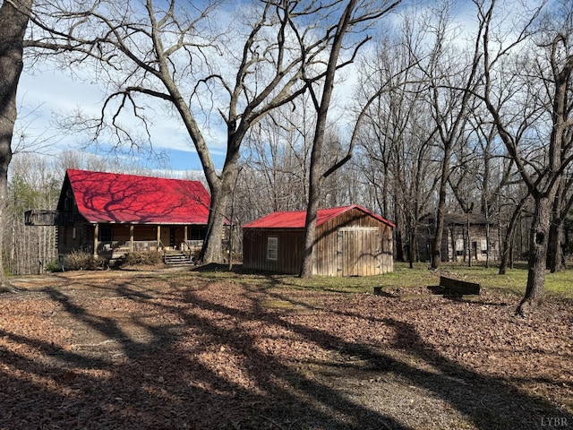 1228 Rosser Mill Rd, Pamplin, VA 23958 - view of yard featuring covered porch and a storage unit