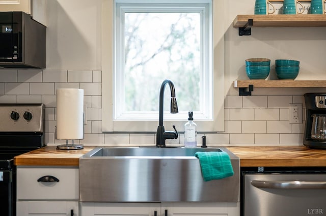 326 Jackson St, Lynchburg, VA 24504 - kitchen featuring open shelves, appliances with stainless steel finishes, a sink, and butcher block countertops