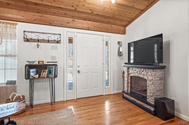 700 Cloudcroft Dr, Monroe, VA 24574 - foyer with lofted ceiling, baseboards, wood ceiling, a fireplace, and wood finished floors