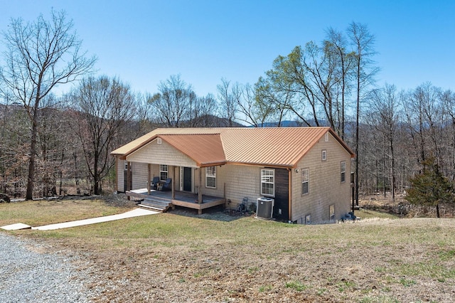 700 Cloudcroft Dr, Monroe, VA 24574 - view of front of property featuring metal roof, a front yard, covered porch, and central AC