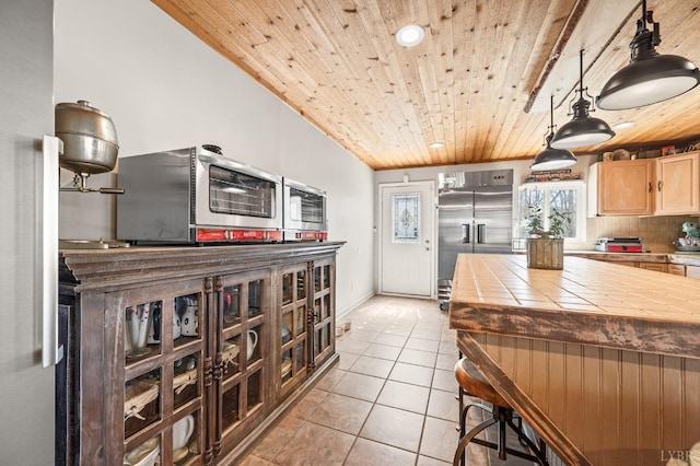 700 Cloudcroft Dr, Monroe, VA 24574 - kitchen with tile counters, light tile patterned floors, wooden ceiling, stainless steel appliances, and light brown cabinets