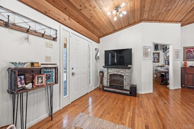 700 Cloudcroft Dr, Monroe, VA 24574 - foyer featuring vaulted ceiling, wood ceiling, hardwood / wood-style flooring, a stone fireplace, and baseboards