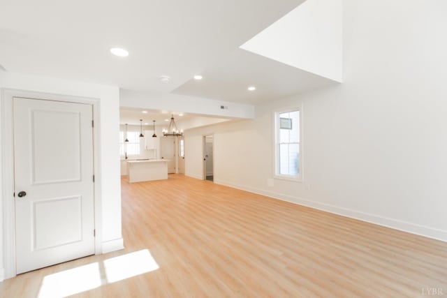 271 Riverside Dr, Lynchburg, VA 24503 - unfurnished living room with light wood-style floors, healthy amount of natural light, recessed lighting, and a chandelier