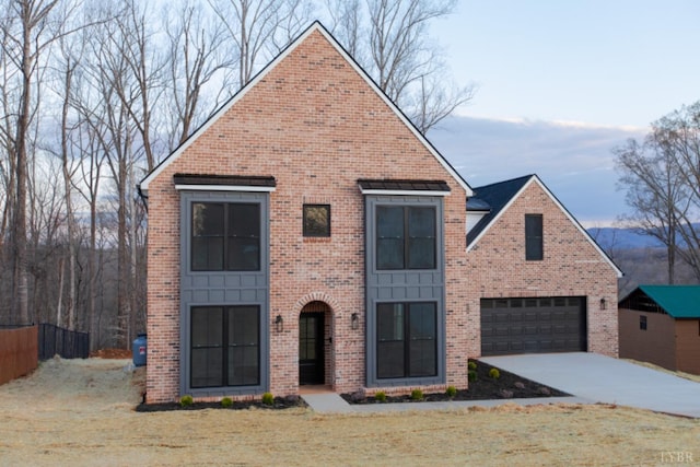 271 Riverside Dr, Lynchburg, VA 24503 - view of front of home with concrete driveway, brick siding, and an attached garage