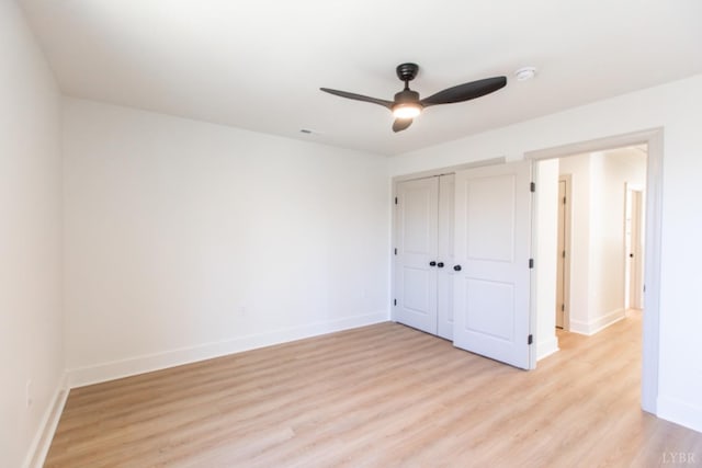 271 Riverside Dr, Lynchburg, VA 24503 - unfurnished bedroom with light wood-style floors, a closet, and a ceiling fan