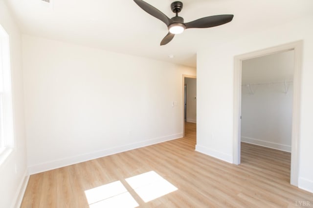 271 Riverside Dr, Lynchburg, VA 24503 - unfurnished bedroom with light wood-style floors, a spacious closet, a closet, and ceiling fan