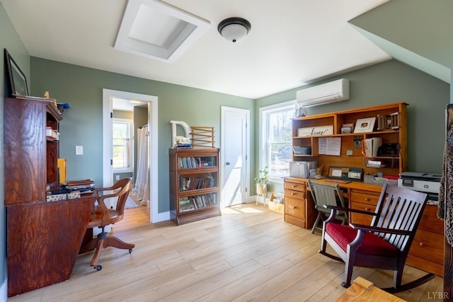 355 Camellia, Hurt, VA 24563 - office space featuring a healthy amount of sunlight, light wood-type flooring, a wall mounted AC, and baseboards