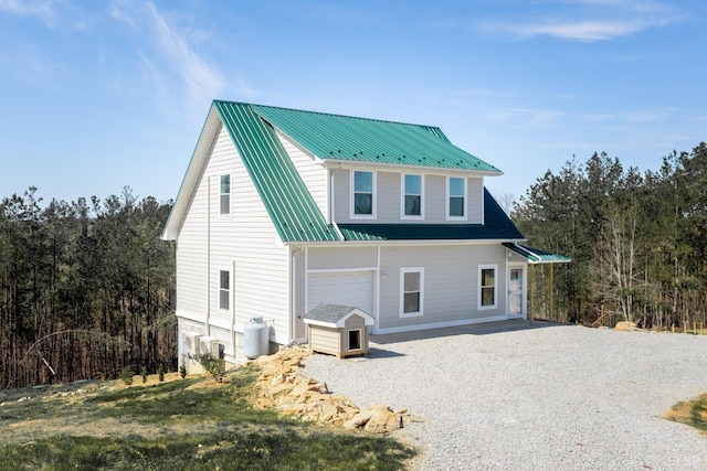 355 Camellia, Hurt, VA 24563 - rear view of house featuring metal roof and gravel driveway
