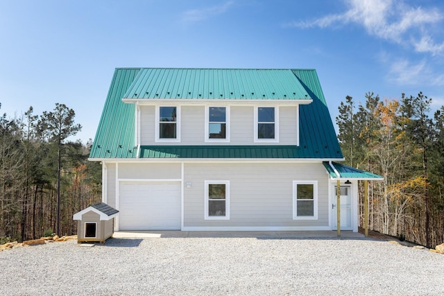 355 Camellia, Hurt, VA 24563 - view of front facade with driveway, metal roof, and a garage