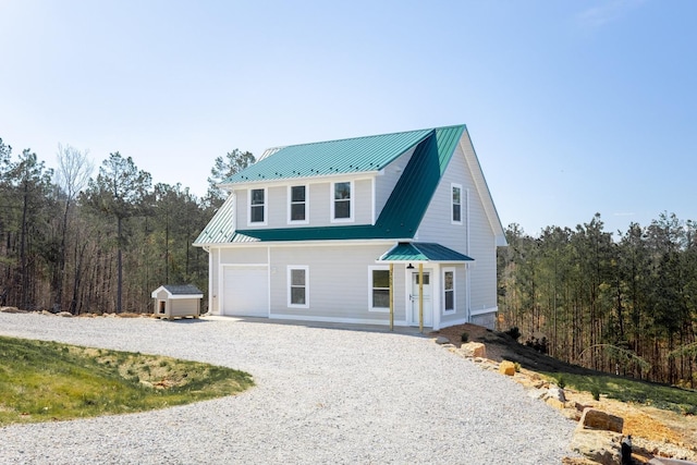 355 Camellia, Hurt, VA 24563 - view of front of home featuring driveway, metal roof, and a garage