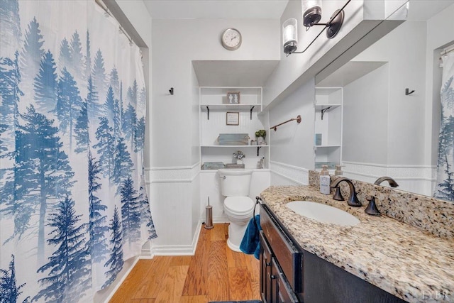 1014 Tall Tree Rd, Wirtz, VA 24184 - bathroom with wood finished floors, vanity, curtained shower, toilet, and a wainscoted wall