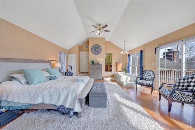 1014 Tall Tree Rd, Wirtz, VA 24184 - bedroom with access to exterior, wood finished floors, a chandelier, ceiling fan, and high vaulted ceiling