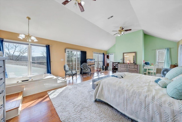 1014 Tall Tree Rd, Wirtz, VA 24184 - bedroom featuring lofted ceiling, wood finished floors, a chandelier, a ceiling fan, and access to outside
