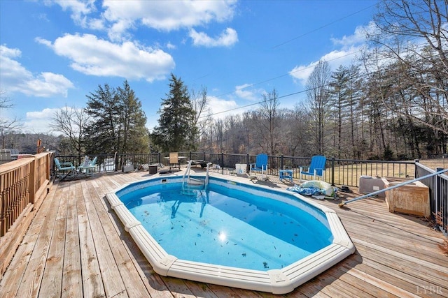 1014 Tall Tree Rd, Wirtz, VA 24184 - view of swimming pool with a deck and view of wooded area