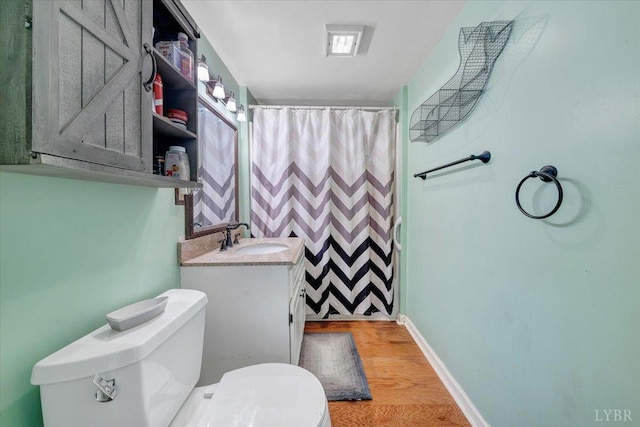 1014 Tall Tree Rd, Wirtz, VA 24184 - full bathroom featuring toilet, wood finished floors, vanity, baseboards, and curtained shower