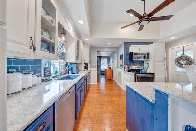 1014 Tall Tree Rd, Wirtz, VA 24184 - kitchen with stainless steel appliances, blue cabinets, white cabinetry, recessed lighting, and ceiling fan
