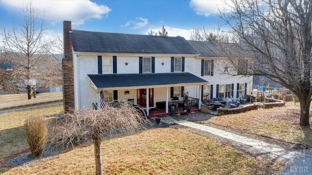 1014 Tall Tree Rd, Wirtz, VA 24184 - view of front of property featuring a chimney, a porch, and a front lawn
