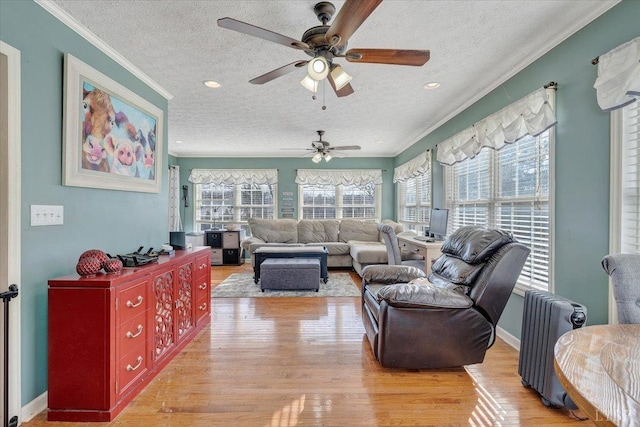 1014 Tall Tree Rd, Wirtz, VA 24184 - living area featuring a textured ceiling, ornamental molding, a ceiling fan, light wood-style floors, and recessed lighting