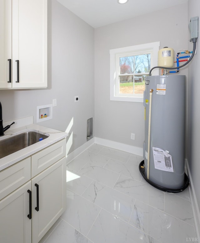 3936 Moorman Dr, Lynchburg, VA 24501 - laundry area with water heater, hookup for an electric dryer, hookup for a washing machine, cabinet space, and baseboards