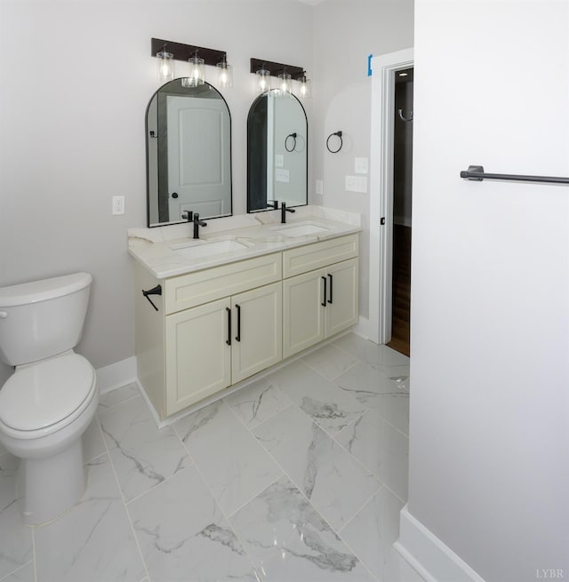3936 Moorman Dr, Lynchburg, VA 24501 - bathroom with baseboards, toilet, double vanity, and marble finish floors