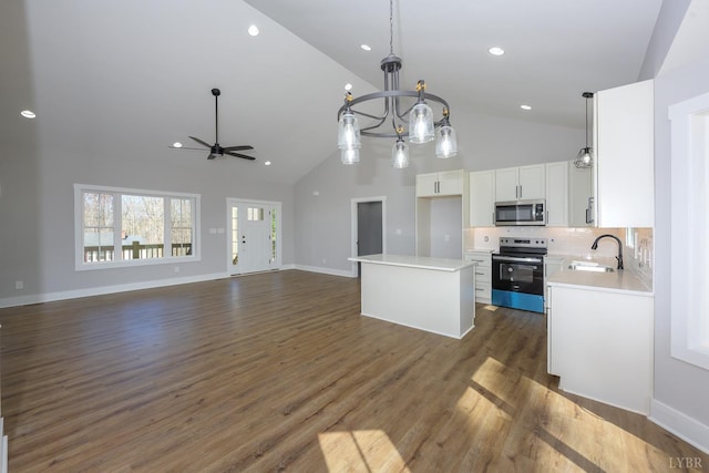 3936 Moorman Dr, Lynchburg, VA 24501 - kitchen featuring electric stove, stainless steel microwave, a center island, a chandelier, and white cabinets