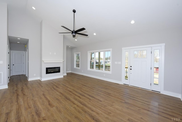 3936 Moorman Dr, Lynchburg, VA 24501 - unfurnished living room with wood finished floors, a glass covered fireplace, recessed lighting, baseboards, and ceiling fan
