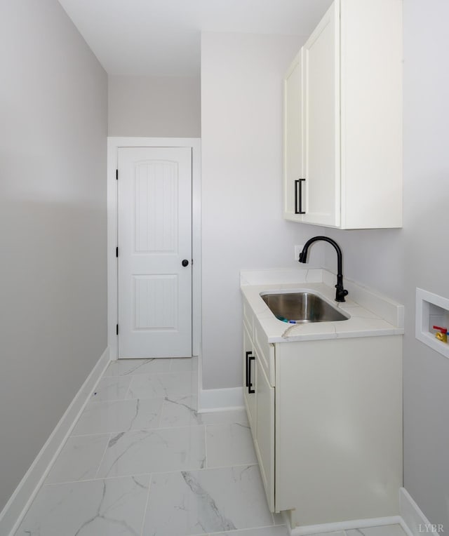 3936 Moorman Dr, Lynchburg, VA 24501 - washroom with cabinet space, washer hookup, baseboards, and light marble finish flooring