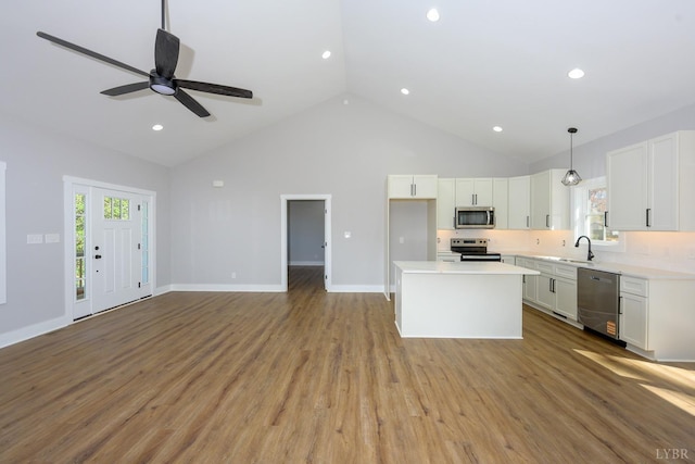 3936 Moorman Dr, Lynchburg, VA 24501 - kitchen featuring appliances with stainless steel finishes, a sink, white cabinets, light countertops, and recessed lighting
