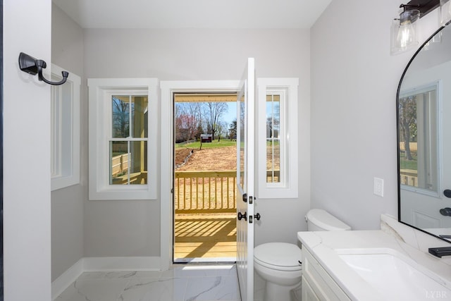 3936 Moorman Dr, Lynchburg, VA 24501 - half bathroom featuring baseboards, toilet, marble look tiles, and vanity