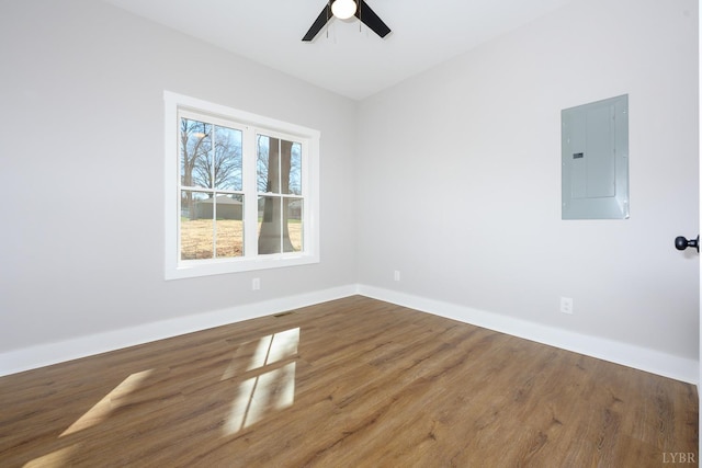 3936 Moorman Dr, Lynchburg, VA 24501 - empty room with electric panel, ceiling fan, wood finished floors, and baseboards
