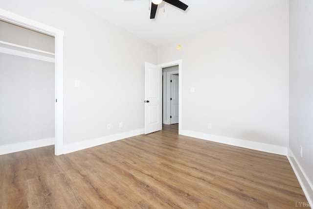 3936 Moorman Dr, Lynchburg, VA 24501 - unfurnished bedroom with wood finished floors, baseboards, and ceiling fan