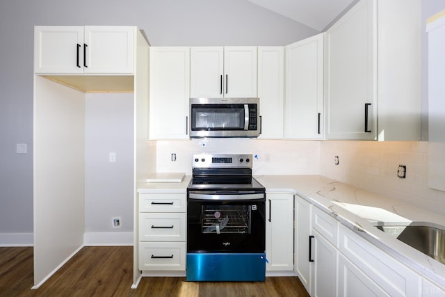3936 Moorman Dr, Lynchburg, VA 24501 - kitchen featuring stainless steel appliances, dark wood-style floors, light stone countertops, white cabinets, and lofted ceiling